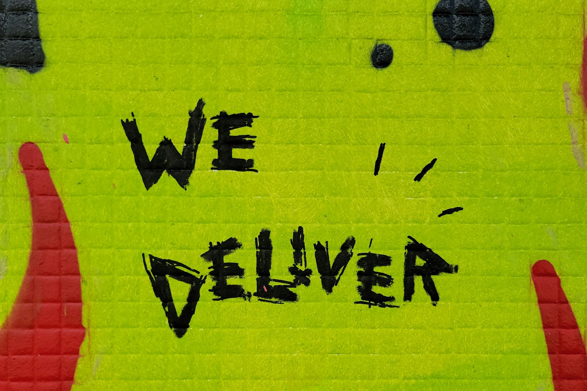 We deliver is written on a wall.